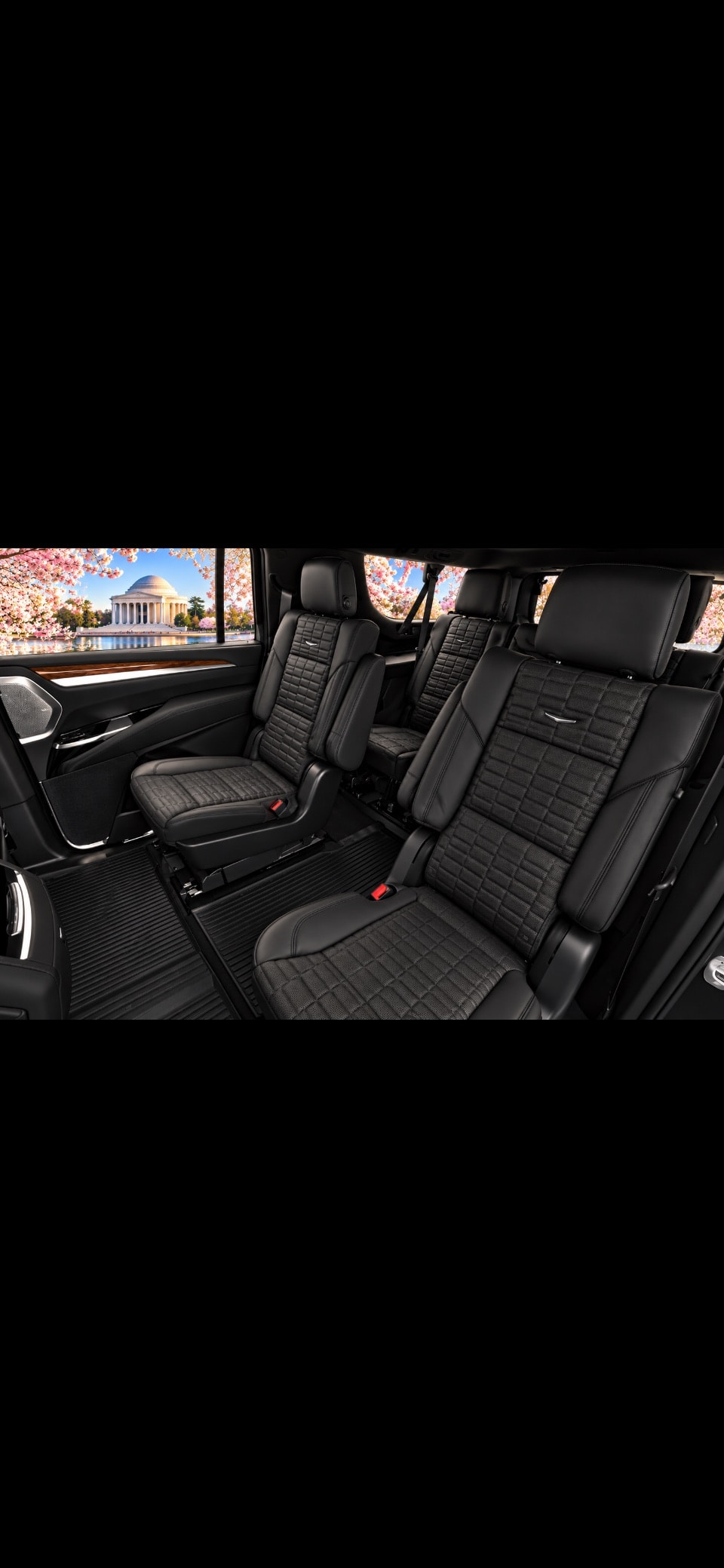 Cadillac Escalade ESV third-row black leather seats with Jefferson Memorial cherry blossom view