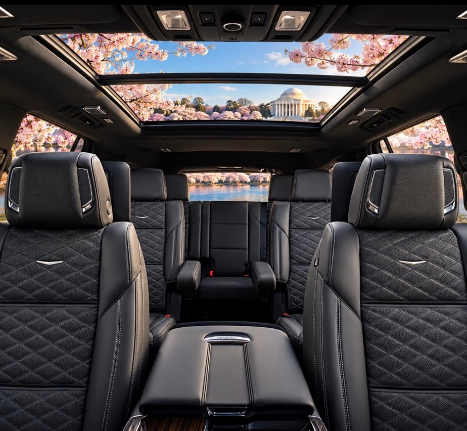 Cadillac Escalade ESV panoramic sunroof interior with rear quilted leather seating and Jefferson Memorial view