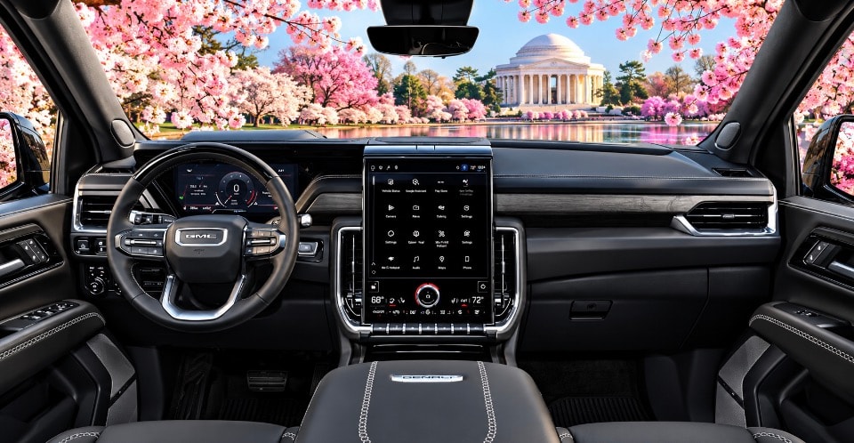 GMC Yukon Denali interior dashboard with large touchscreen and cherry blossom view