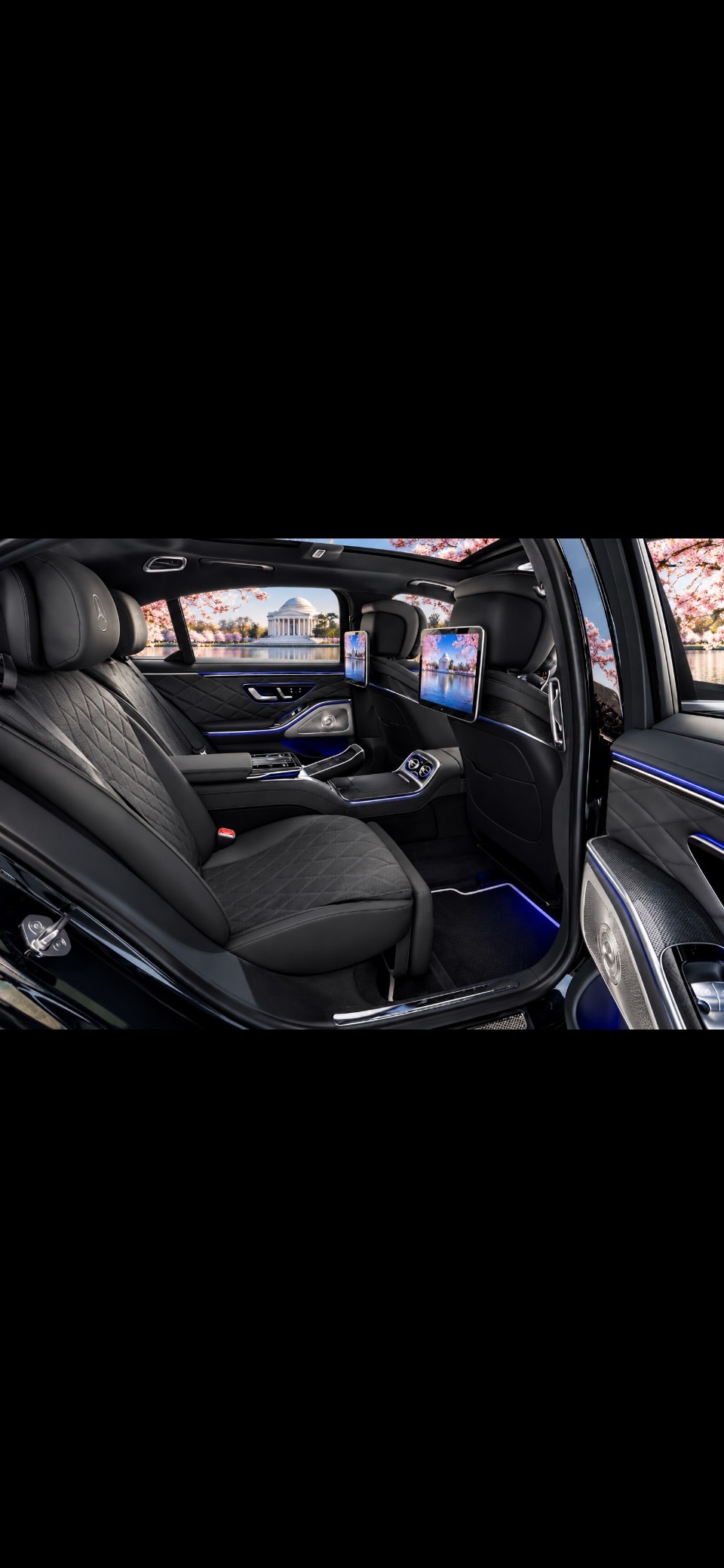 Mercedes S580 cognac leather rear seats with Perrier refreshments
