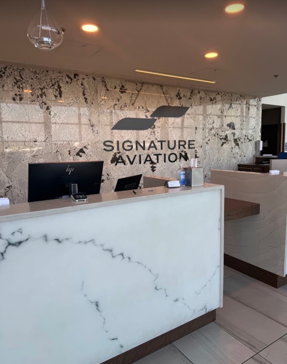 Signature Aviation modern reception desk marble interior