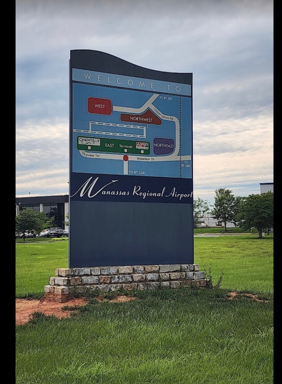 Manassas Regional Airport welcome sign with terminal map