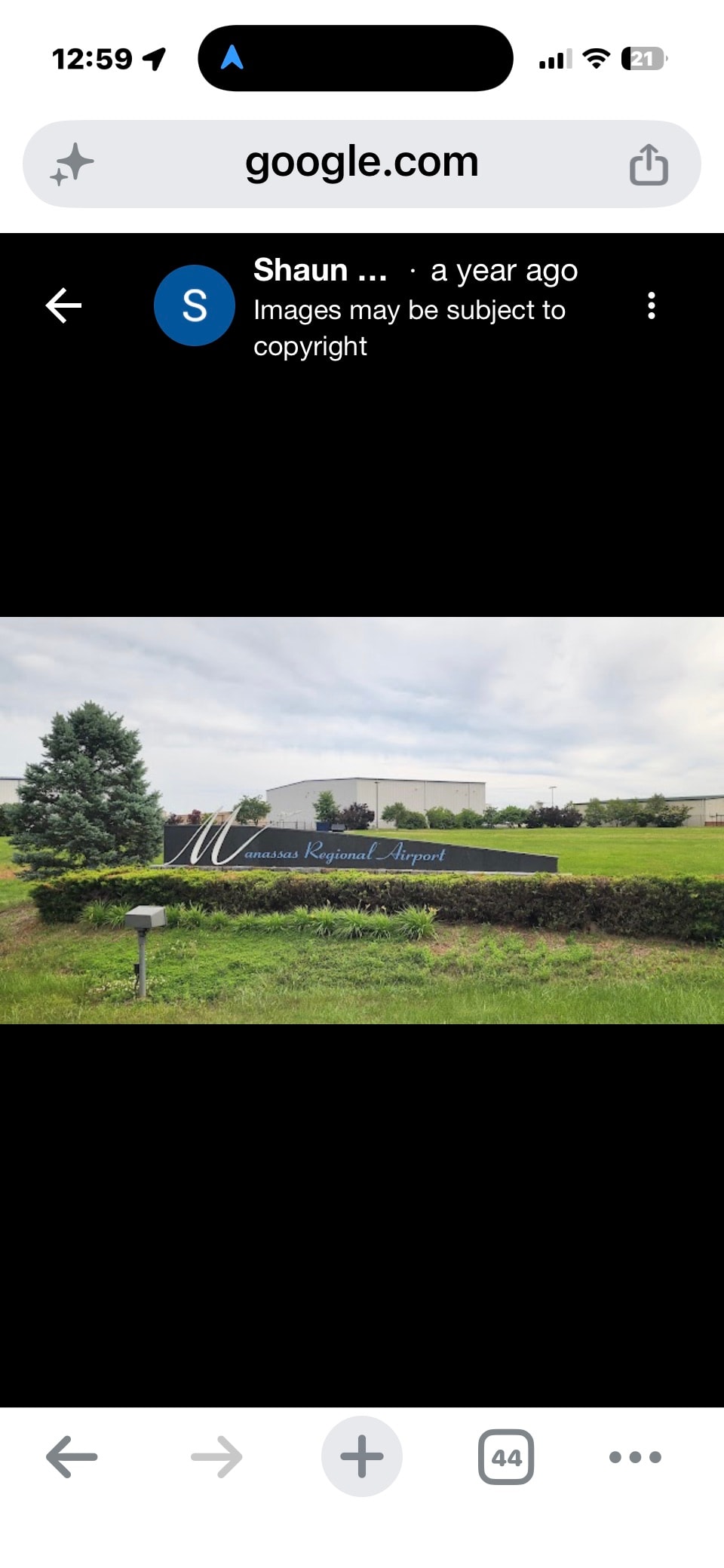 Manassas Regional Airport entrance sign landscaped grounds