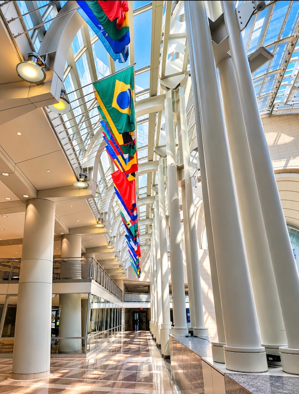 International flags in modern trade center atrium