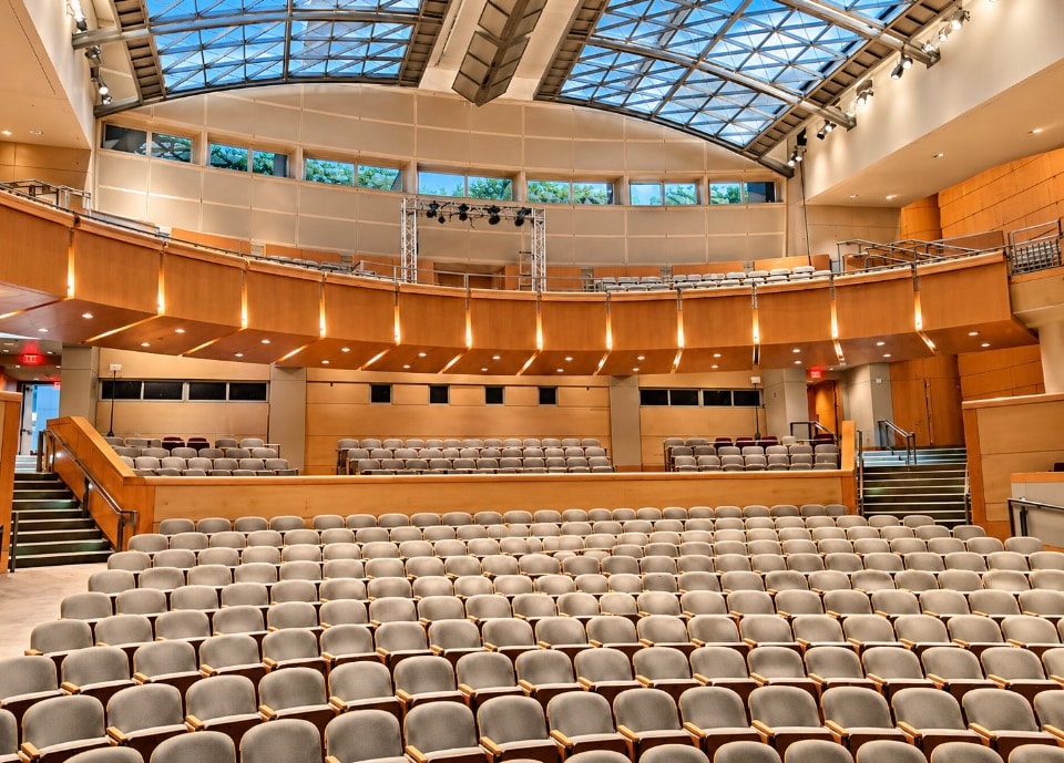 Auditorium with tiered seating and skylight