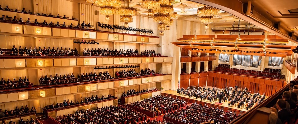 Kennedy Center Concert Hall interior with orchestra performing and full audience