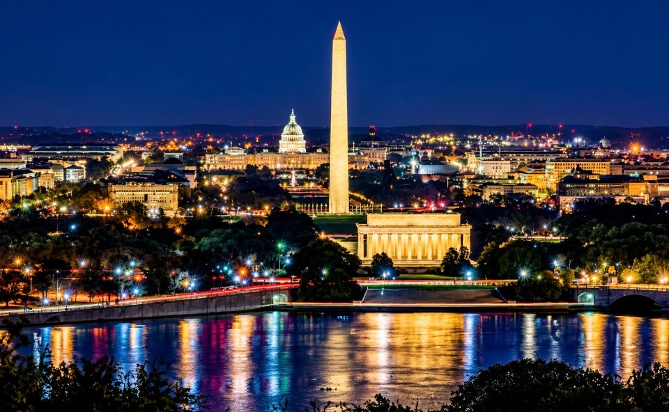 Washington DC skyline at night with Lincoln Memorial Washington Monument and Capitol reflections