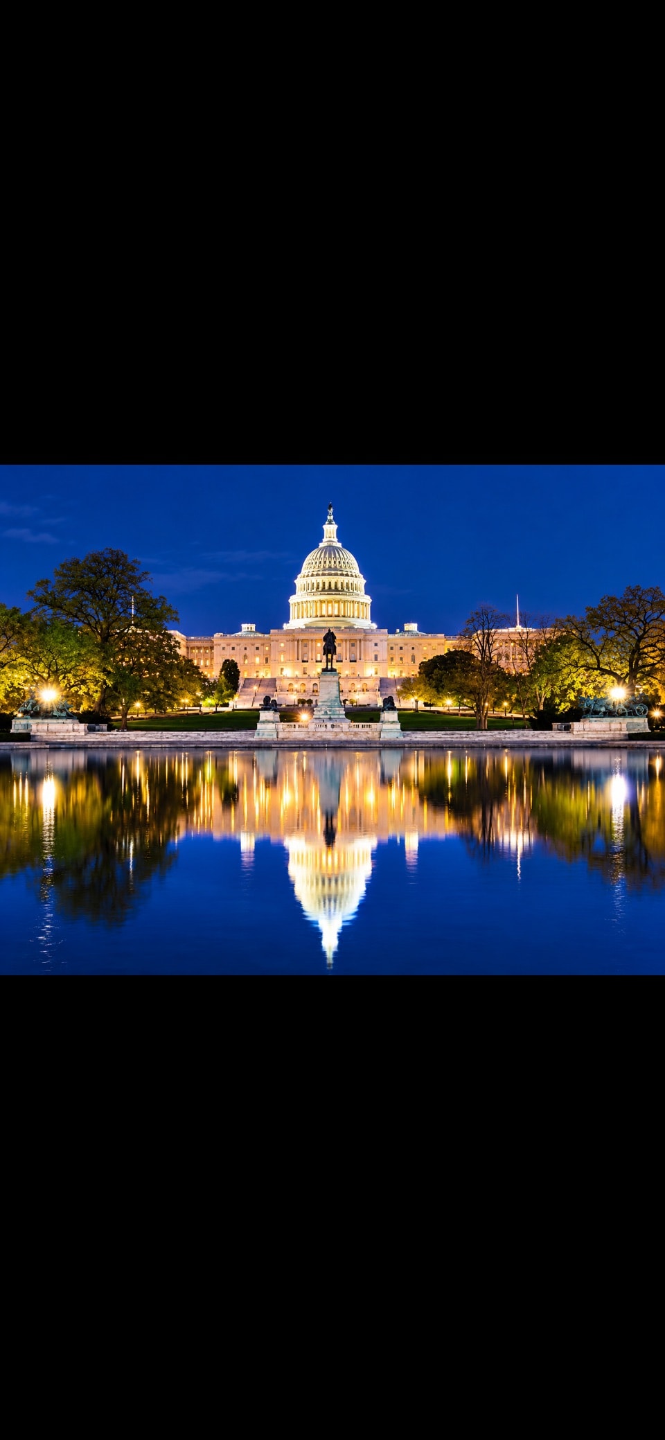 US Capitol building night reflection in pool blue hour